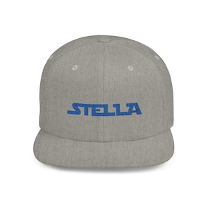 May include: A gray and blue baseball cap with the word "STELLA" embroidered in blue on the front.