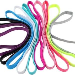 May include: A set of 12 colorful hair ties in various shades of blue, pink, purple, green, and yellow. The hair ties are made of a soft, stretchy material and are perfect for keeping hair out of the face.