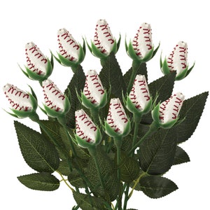 May include: A bouquet of white roses with red stitching, resembling baseballs, with green leaves.