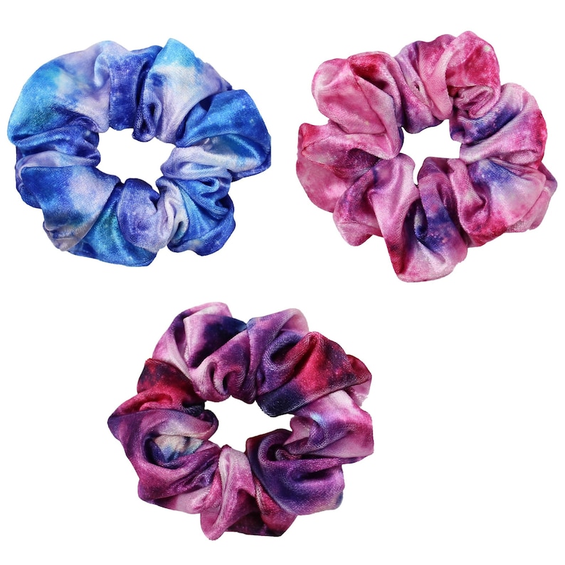 May include: Three colorful scrunchies with a tie-dye pattern. The scrunchies are blue, pink, and purple.