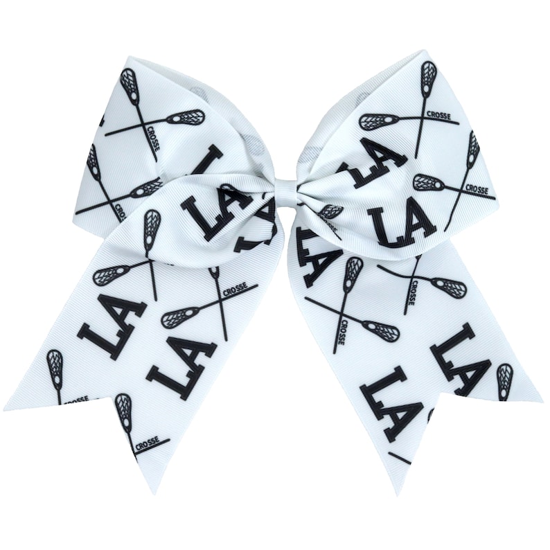 May include: White cheer bow with black lacrosse sticks and "LA" printed on it.