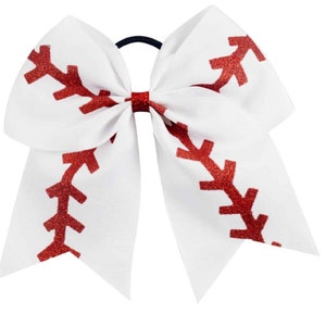 May include: White cheer bow with a red glitter baseball stitch design.