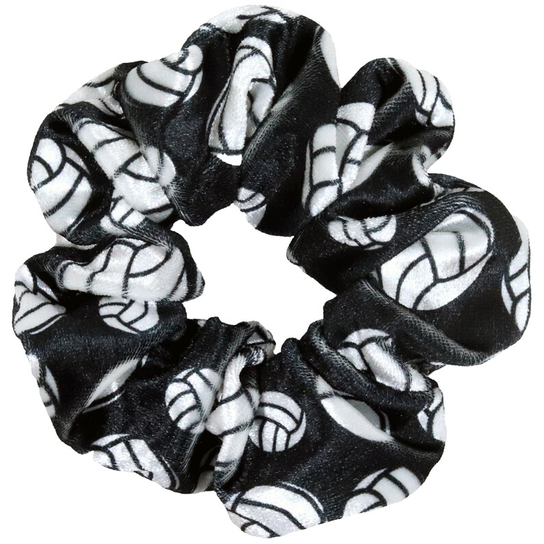 May include: Black velvet scrunchie with a white volleyball pattern.