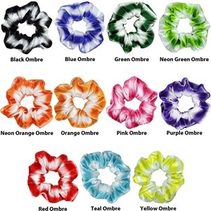 May include: Twelve colorful hair scrunchies with ombre designs. The scrunchies are made of satin and have a white base with a variety of colors, including black, blue, green, neon green, neon orange, orange, pink, purple, red, teal, and yellow.