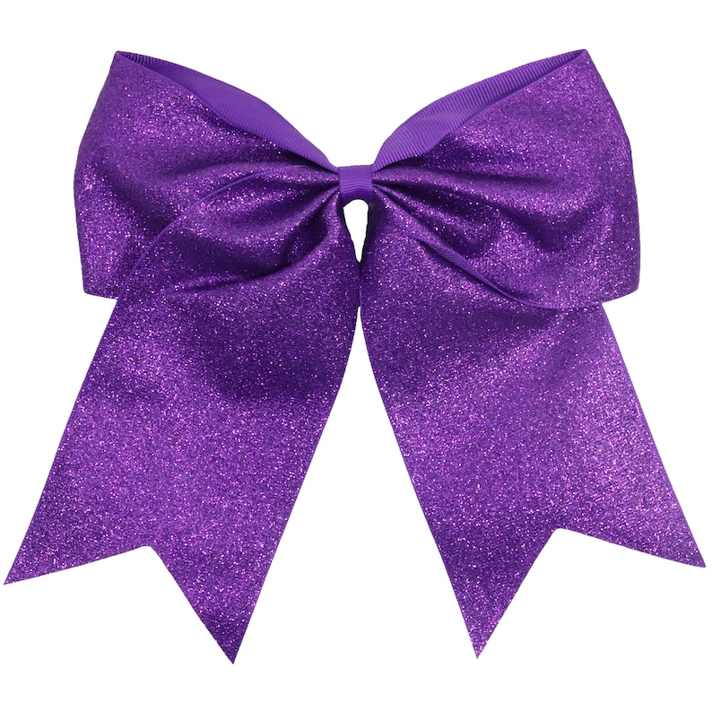 May include: A large, vibrant purple bow with a glittery finish. The bow features a classic design with two long, pointed streamers and a central knot. The ribbon has a textured appearance, adding visual interest to the accessory.