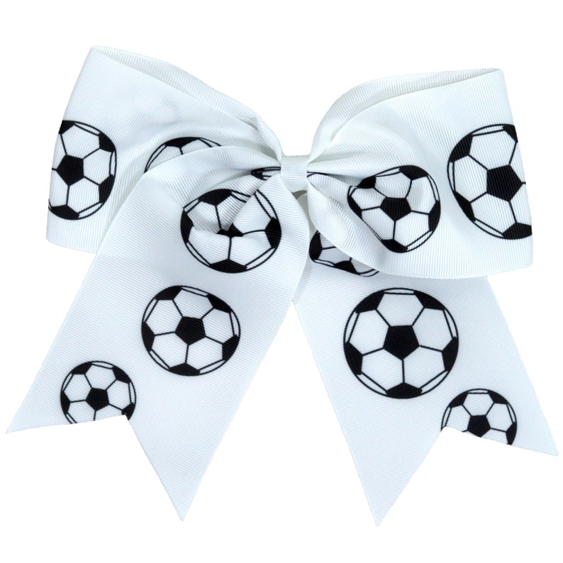 May include: White hair bow with a black soccer ball pattern.