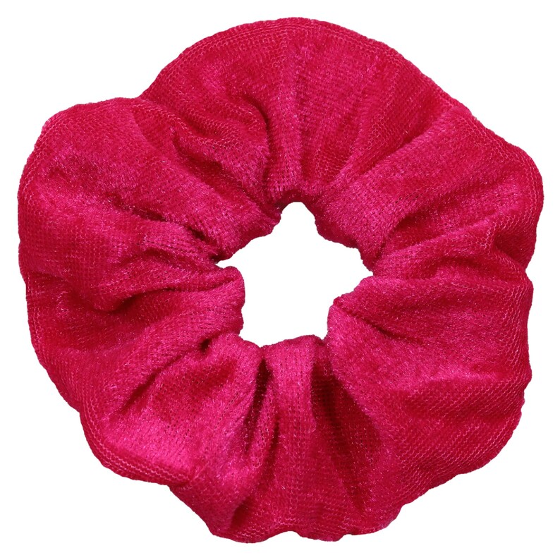 May include: A bright pink velvet scrunchie for hair.