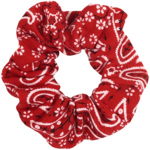 May include: Red and white bandana print scrunchie hair tie.