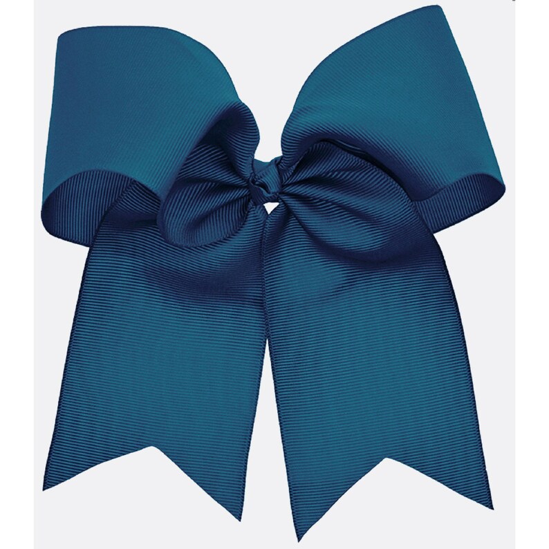 May include: A large teal blue hair bow with a double loop and two long tails.