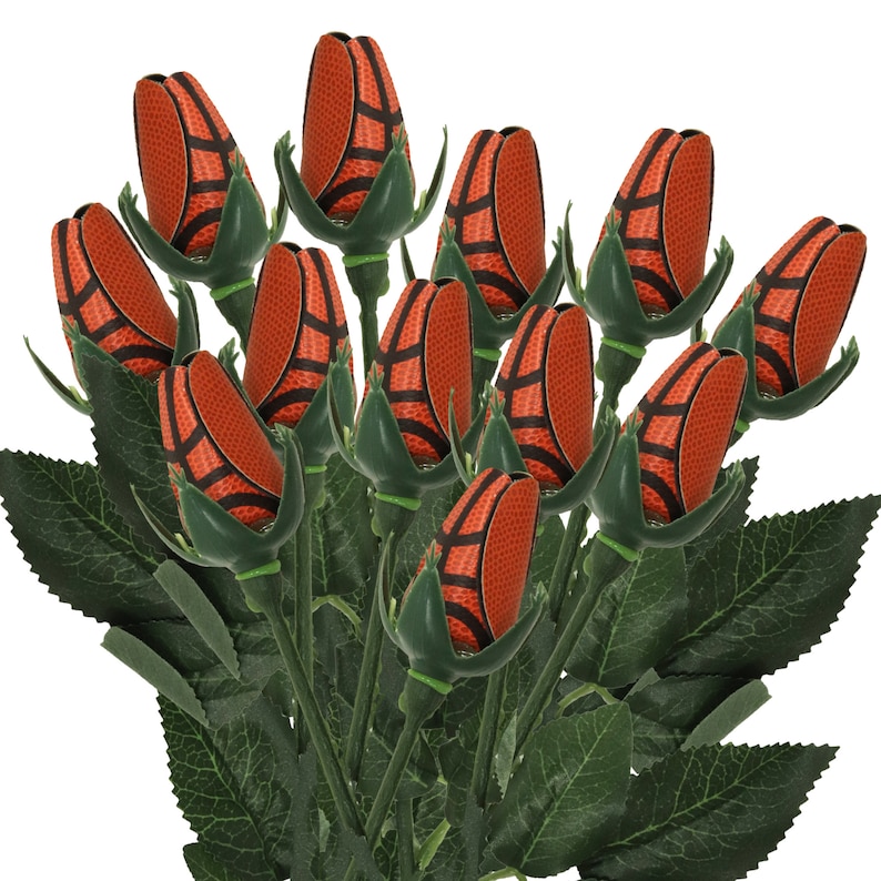 May include: A bouquet of artificial roses with basketball-patterned flower heads. The roses are arranged in a vase and have green leaves.