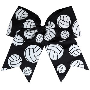 May include: Black and white cheer bow with a volleyball pattern. The bow is made of black ribbon with white volleyball designs.