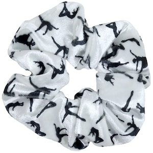 May include: White velvet scrunchie with a black silhouette pattern of dancers.
