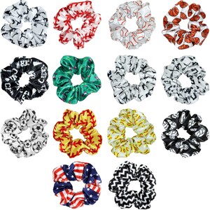 May include: Set of 12 colorful scrunchies with various sports-themed designs, including baseball, basketball, soccer, and cheerleading. The scrunchies are made of soft, stretchy fabric and are perfect for holding hair in place.
