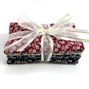 4 Fat Quarters Bundle, Red, Cream, Blue, and Black with Floral Accents image 1