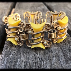 Vintage Thermoset Yellow and Gold Tone Scroll Six Panel Bracelet With Faux Pearls - Fabulous!