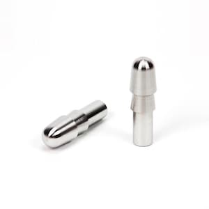 May include: Two shiny, silver metal objects are displayed against a white background. One object is cylindrical with a rounded tip, lying horizontally. The other is upright, with a layered design and a rounded top. Both have a polished finish.