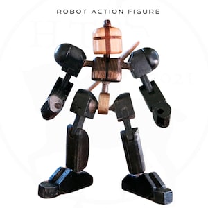 May include: A wooden robot action figure with black limbs and a brown wooden head. The robot has a red cross on its head.