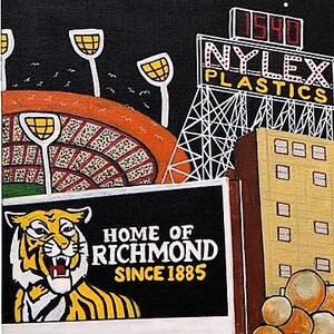 May include: A painting depicting a stadium with orange seating and floodlights, a Nylex Plastics sign with the number 1540, and a black sign featuring a tiger illustration with the text Home of Richmond Since 1885 next to a tan building.