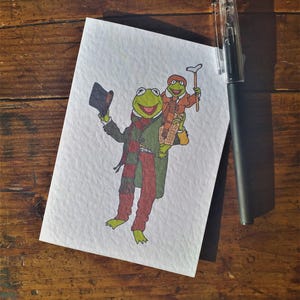 Canto di Natale dei Muppet - Kermit e Robin nei panni di Bob e Tiny Tim Biglietto d'auguri A6 con busta