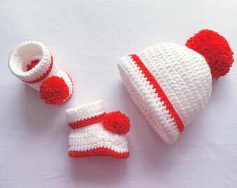 my first christmas hat and booties
