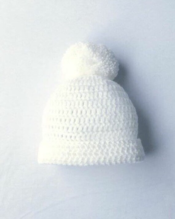 white pom pom hat baby