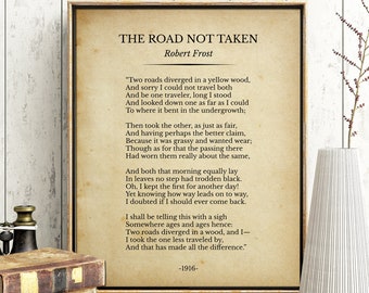 May include: A framed print of Robert Frost's poem "The Road Not Taken". The poem is printed on a vintage-style paper with a brown background. The poem is about two roads diverging in a yellow wood, and the speaker choosing the less traveled road.