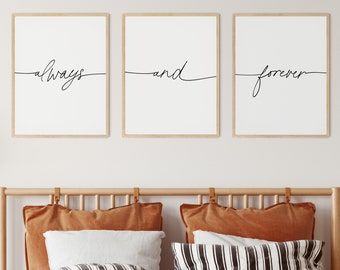 May include: Three framed prints with the words "always", "and", and "forever" written in cursive script. The prints are hanging on a white wall above a bed with a brown headboard and brown and white striped bedding.