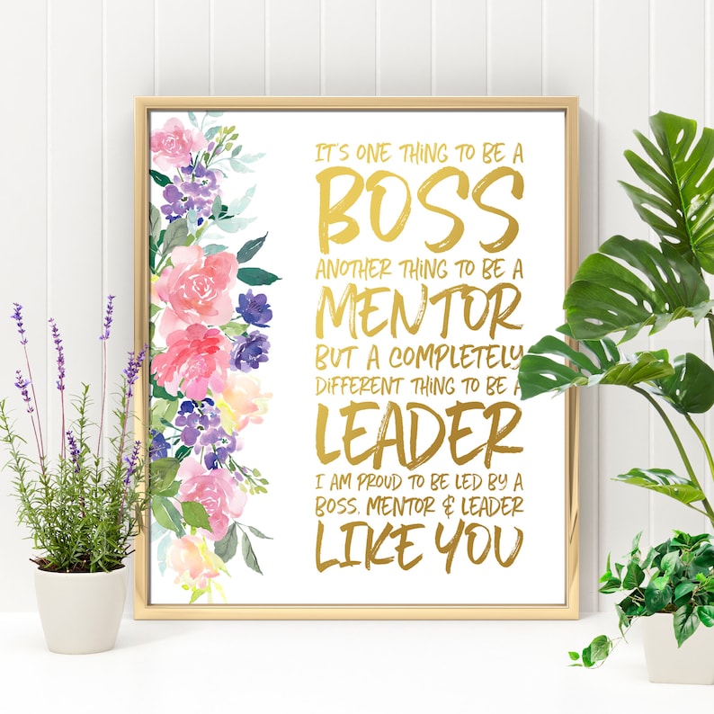 May include: A gold foil print with a floral design on a white background. The text reads "It's one thing to be a boss, another thing to be a mentor, but a completely different thing to be a leader. I am proud to be led by a boss, mentor & leader like you."