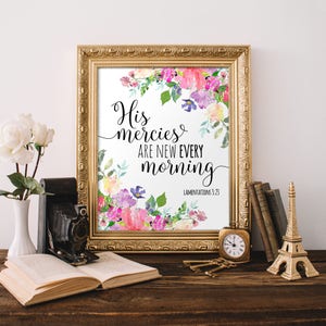 May include: A framed print with a floral design and the text "His mercies are new every morning" with the scripture reference "Lamentations 3:23".