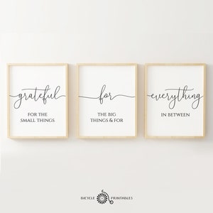 May include: Three printable wall art prints with a minimalist design. The prints feature the words "grateful", "for", and "everything" in a handwritten font. The text is accompanied by smaller text that reads "for the small things", "the big things & for", and "in between".