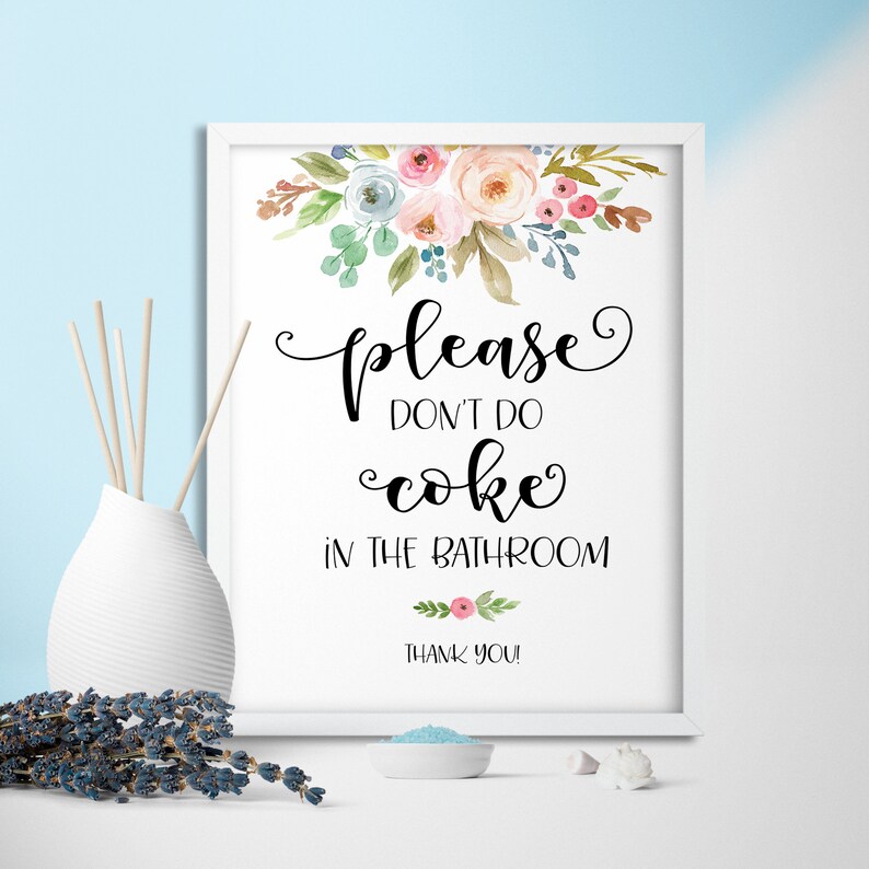 May include: A white framed sign with a floral design at the top. The sign says "Please don't do coke in the bathroom. Thank you!"
