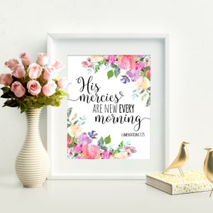 May include: A white framed print with a floral design and the text "His mercies are new every morning" with the scripture reference "Lamentations 3:23".