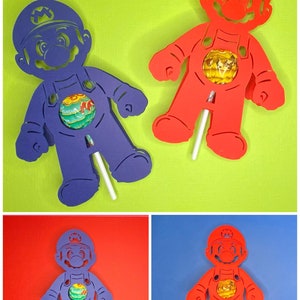 May include: Four cutout figures of the video game character Mario, two in red and two in purple, with a lollipop in the center of each figure. The figures are on different colored backgrounds.