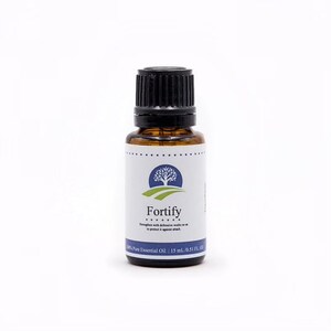 May include: A small amber glass bottle with a black cap, labeled "Fortify" with a tree logo. The bottle contains 100% pure essential oil and is 15 ml (0.51 fl oz).