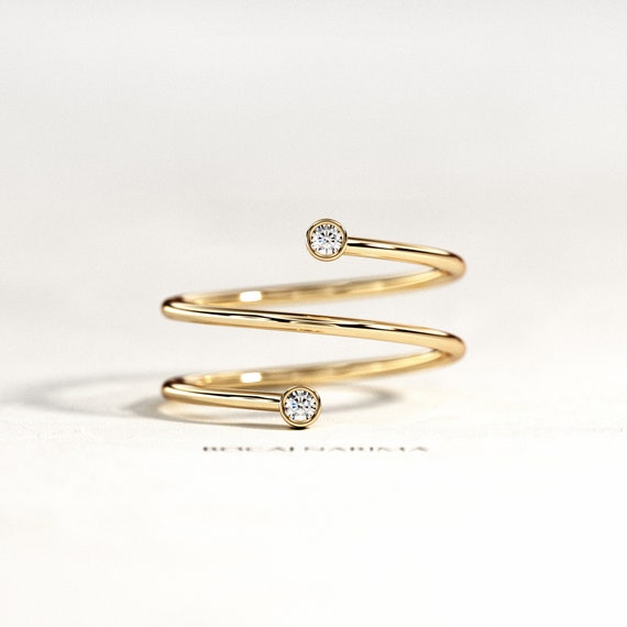 Gold swirl best sale ring