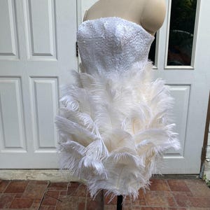 ostrich feather dress white Amara sleeveless with the dramatic skirt featuring a sweeping 50 train that cascades gracefully behind Feather Dress Womens White Sequin