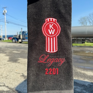 May include: Black towel with a red embroidered KW logo and the text "Legacy 2201".