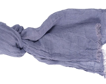 May include: A soft, gray scarf with a frayed edge. The scarf is made of a lightweight fabric and is perfect for adding a touch of warmth and style to any outfit.