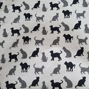 May include: A seamless pattern of black cats on a light beige background. The cats are in various poses, including sitting, standing, and walking. The pattern is perfect for fabric, wallpaper, or wrapping paper.