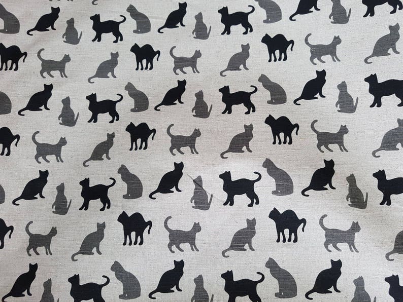 May include: A seamless pattern of black cats on a light beige background. The cats are in various poses, including sitting, standing, and walking. The pattern is perfect for fabric, wallpaper, or wrapping paper.