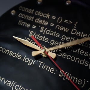 Tech-inspired resin clock showcasing JavaScript code for frontend developers