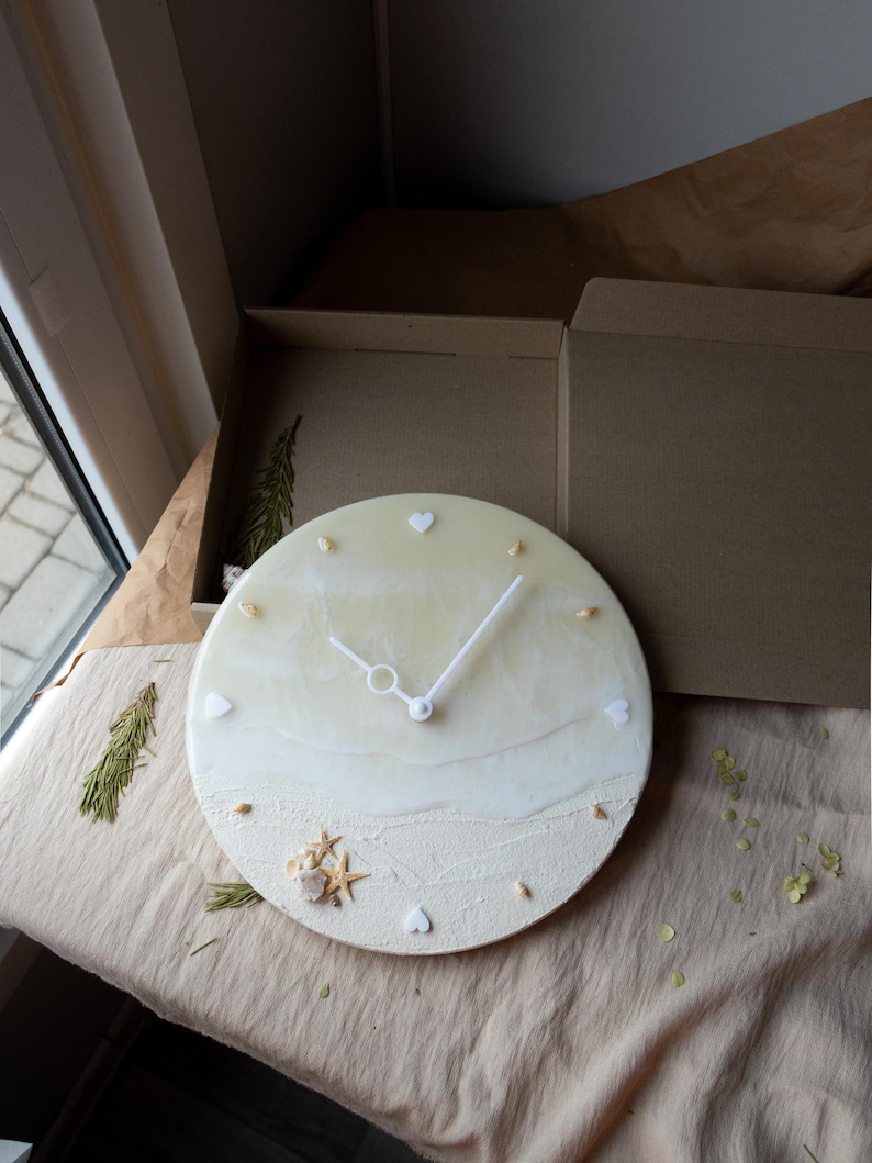 Nautical resin wall clock with agate geode and coastal charm for bedroom decor.