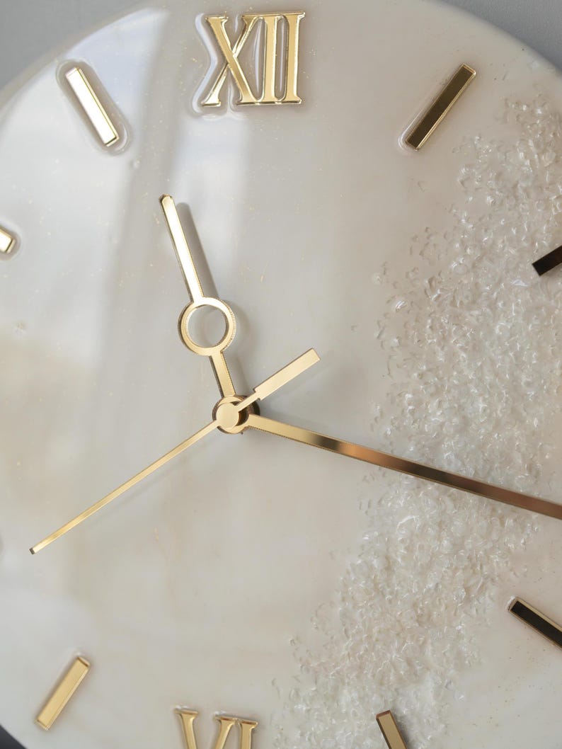 Close-up of the clock, focusing on the Roman numerals and the fine gold details of the clock face.