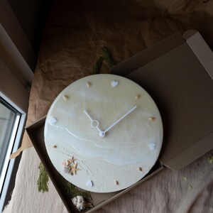 Handcrafted resin clock with a nautical vibe, perfect for aesthetic home decor.