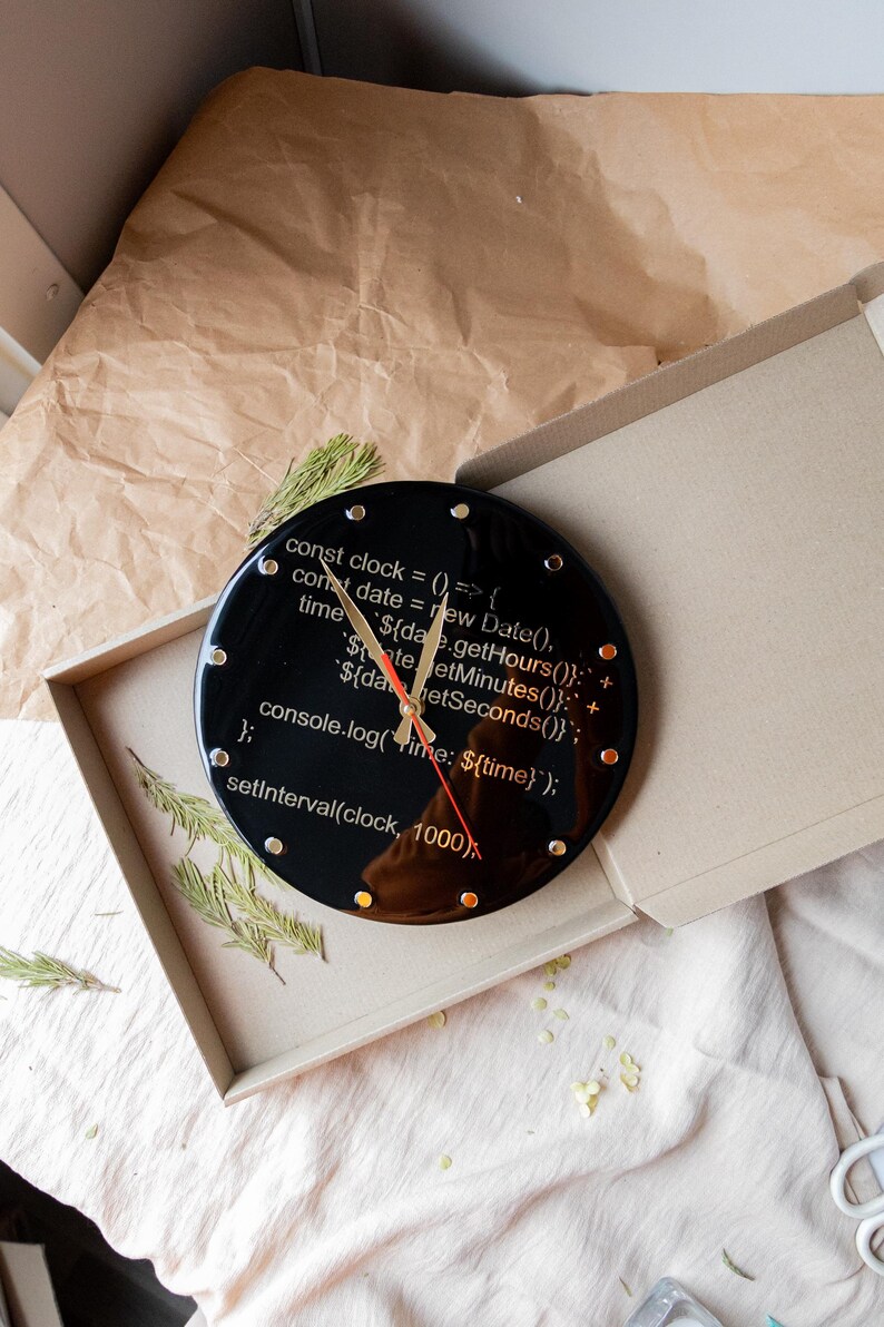 A modern resin clock for tech lovers, featuring JavaScript-inspired design and a polished finish