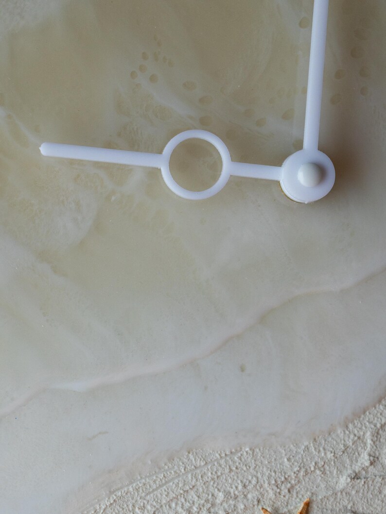 White acrylic hands, Modern resin clock showcasing layered waves and natural sea elements