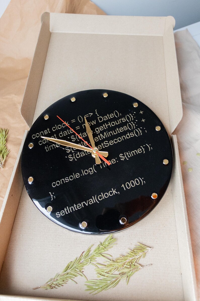 A unique wall clock with a coding theme, featuring bold JavaScript snippets