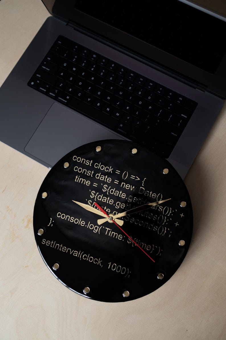 Personalized resin clock with golden accents and coding details, a geek's favorite decor.