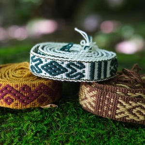 Tšombiach or &quot;chumbe&quot;, traditional handmade embroiderd belt, womb sash made by Kamentsà natives from Colombia representings sacred symbology
