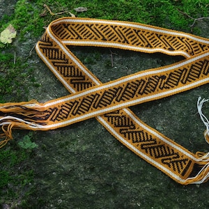 Tšombiach or &quot;chumbe&quot;, traditional handmade embroiderd belt, womb sash made by Kamentsà natives from Colombia representings sacred symbology